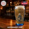 Lord of the Rings 20th anniversary beer glass with gold crest, swords, and helmet graphic on a pub bar background!