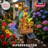 Solar garden stake featuring a colorful parrot playing ukulele with a margarita and burger sign reading PARROT HEAD PARADISE!
