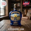 Blue glass liquor bottle commemorating Michigan Stadium 100th anniversary with a bear wearing a construction hat stopper!