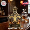 Gold New Orleans Saints 60th anniversary liquor decanter shaped like a fleur-de-lis with a crown topper and metal plaque!