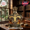 Glass crown-shaped decanter with gold New Orleans Saints fleur-de-lis logo and 60th anniversary text on wooden desk!