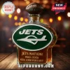 New York Jets 65th anniversary glass liquor decanter with football topper and green oval logo on wooden bar table!