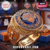 Gold championship ring featuring New York Knicks logo, blue gemstones, and 2026 Eastern Conference Champions text!