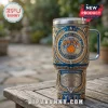 Blue insulated tumbler featuring gold ornate patterns, New York Knicks logo, and Madison Square Garden design!