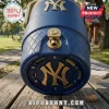 Close up of the base of a textured blue water cooler displaying a large gold New York Yankees logo and exposed electronic charging contacts!