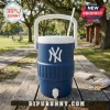 A blue fan themed cooler cup sitting on a wooden table with snacks in a park!
