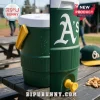 Two views of a green water cooler sitting on a wooden outdoor table!