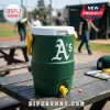 Green Oakland As water cooler on a picnic table at a baseball field!