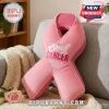 Pink ribbon shaped plush pillow with white and pink text reading October Breast Cancer Awareness Month!