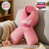 Pink ribbon shaped throw pillow with October Breast Cancer Awareness Month text embroidery on a grey sofa!