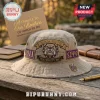 Tan bucket hat with Omega Psi Phi fraternity embroidery featuring a bulldog logo, 1911, and Greek letters in purple gold.!