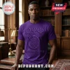 Purple Omega Psi Phi fraternity t-shirt with Greek letters and crest in embossed style on a man in a library!