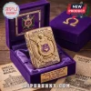 Golden ornate lighter with Omega Psi Phi crest in purple velvet box. 