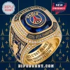 Gold championship ring featuring Paris Saint-Germain logo, blue stone, and UEFA Champions League 2026 text details!