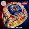 Gold PSG 2026 UEFA Champions ring with blue sapphire center, red accents, and text reading Paris Saint Germain Champions!