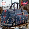Blue quilted Paris Saint-Germain travel duffel shaped like a bus with soccer logos and Parc Des Princes text!