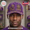 Purple baseball cap with gold Omega Psi Phi embroidery, bulldog mascot, and personalized text on a man.!