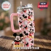 Pink glitter stainless steel tumbler with Mickey Mouse pattern, name Charlie, and plush Mickey charm on handle!