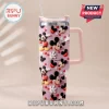 Pink glitter insulated tumbler with Mickey Mouse heads, red hearts, and white gloves pattern featuring name Sophia!