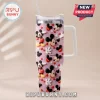 Pink glitter stainless steel tumbler with 3D Mickey Mouse heads, red hearts, and the personalized name Sophia!