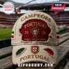 Beige distressed baseball cap, retro style! Features red and green patches, Portuguese emblem! Text: CAMPEÕES PORTUGAL 20 26 GARRA PAIXÃO GLÓRIA!