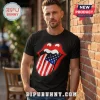 Black t-shirt featuring a red lips graphic with an American flag tongue design worn by a man against a brick wall!