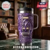 Purple Prince themed tumbler with guitar and Purple Rain text on a marble surface against a library background!