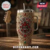 Silver steel tumbler with Red Hot Chili Peppers logo, ornate gold scrollwork, and embedded red and green gemstone accents!