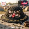 Distressed black bucket hat with The Rolling Stones logo, red tongue, white lips, EST. 1962, gold text 