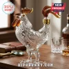 Clear glass rooster shaped whiskey decanter with amber accents on a wooden desk!