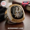San Antonio Spurs championship ring with black stone, gold logo, and diamond accents on a wooden table!