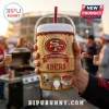 Close up view of a gold 49ers 80th anniversary cooler cup held outdoors!