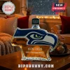 Seahawks logo glass whiskey decanter with 1976-2026 50th Anniversary text on a wooden table!