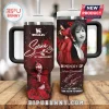 Red black Stanley tumbler with Selena photos, red roses, white speckles, and text 