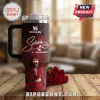 Dark red speckled Stanley-style tumbler with white Selena script, red roses, 