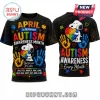 Black t-shirt featuring Snoopy, colorful puzzle pieces, handprints, and text about Autism Awareness Month.!