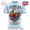 Light blue t-shirt with Snoopy as Flying Ace in a red plane, text says Flying Ace 41 Years 1985-2026, cartoon style!