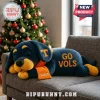 Plush navy and orange Tennessee Volunteers dog toy with text Go Vols and Charlie on a gray sofa against a Christmas tree!