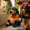 Plush black and tan dog toy wearing an orange football jersey with T logo and 00 number on a couch by a Christmas tree!