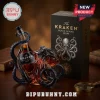 The Kraken Black Spiced Rum bottle encased in blue octopus glass sculpture next to black branded box on wooden table!