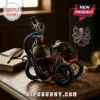 Glass whiskey decanter shaped like a dark blue octopus with tentacles wrapped around the neck and body of the bottle!