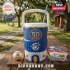 A blue and white Toronto Blue Jays anniversary cooler cup on a wooden picnic table outdoors!