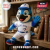 Plush Blue Jays mascot doll wearing a white pinstripe baseball uniform and blue cap with team logo on a wooden shelf!