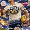 Cream and blue distressed West Coast Eagles polo with eagle graphic and 2026 text at a stadium!