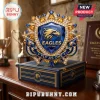 Gold and blue jeweled Eagles crest plaque with gems and text Eagles Est 1986 Fly As One on a blue gift box!