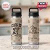 Beige insulated water bottle with black lid, stainless steel base, husky dog in cowboy hat, 