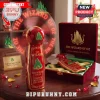 Red and gold Wizard of Oz collectible fan, Emerald City art, 'THE WIZARD OF OZ' text, 'THERE'S NO PLACE LIKE HOME'!