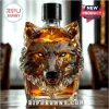 Crystal wolf head whiskey decanter with amber liquid and Bipubunny logo on a wooden table!