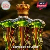 Monster energy drink glass bottle shape with gold royal crown topper and green accents on dark blurry background!