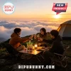 Monster Energy logo lamp on a wooden camping table with three people toasting glasses at sunset above clouds!